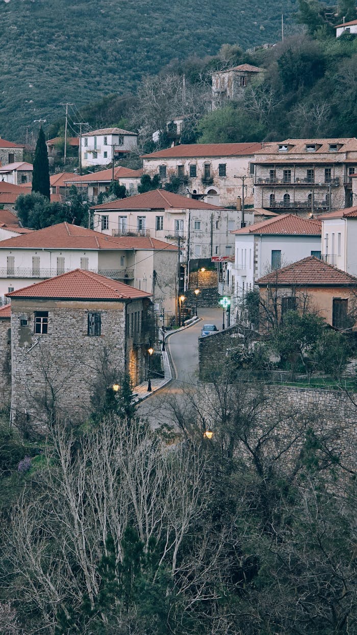 gallery-01 Picturesque Mediterranean village with traditional stone houses and red-tiled roofs.